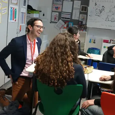 Staff and students interacting