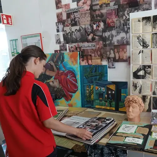 Student looking at art