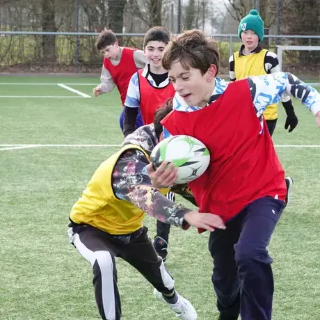 Students playing rugby