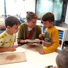 Teacher interacting with children in class