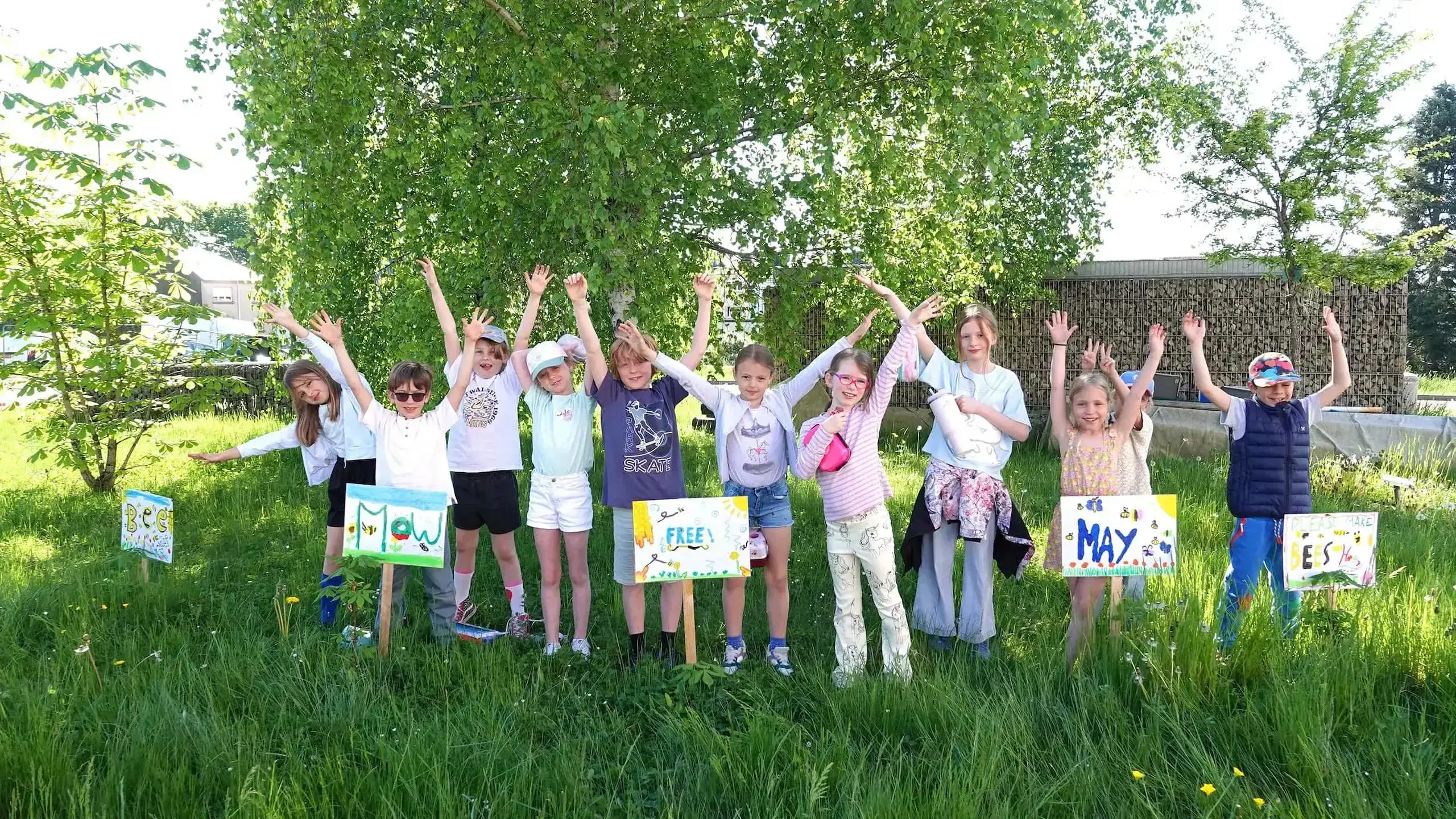 Students celebrating in field