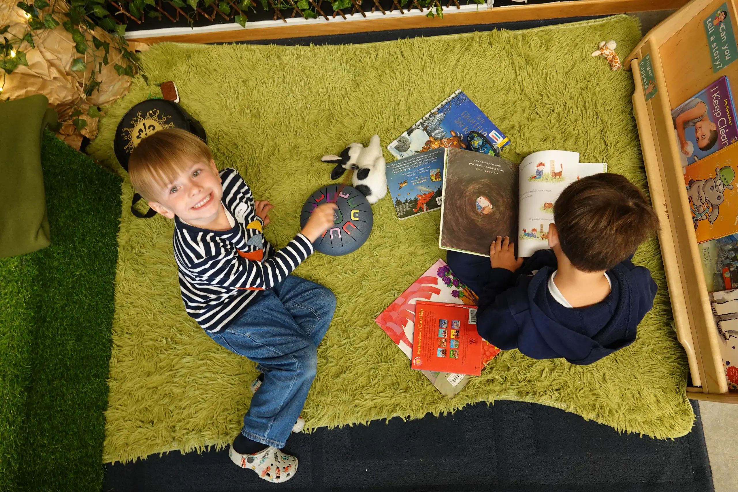 Two children playing at indoor picnic