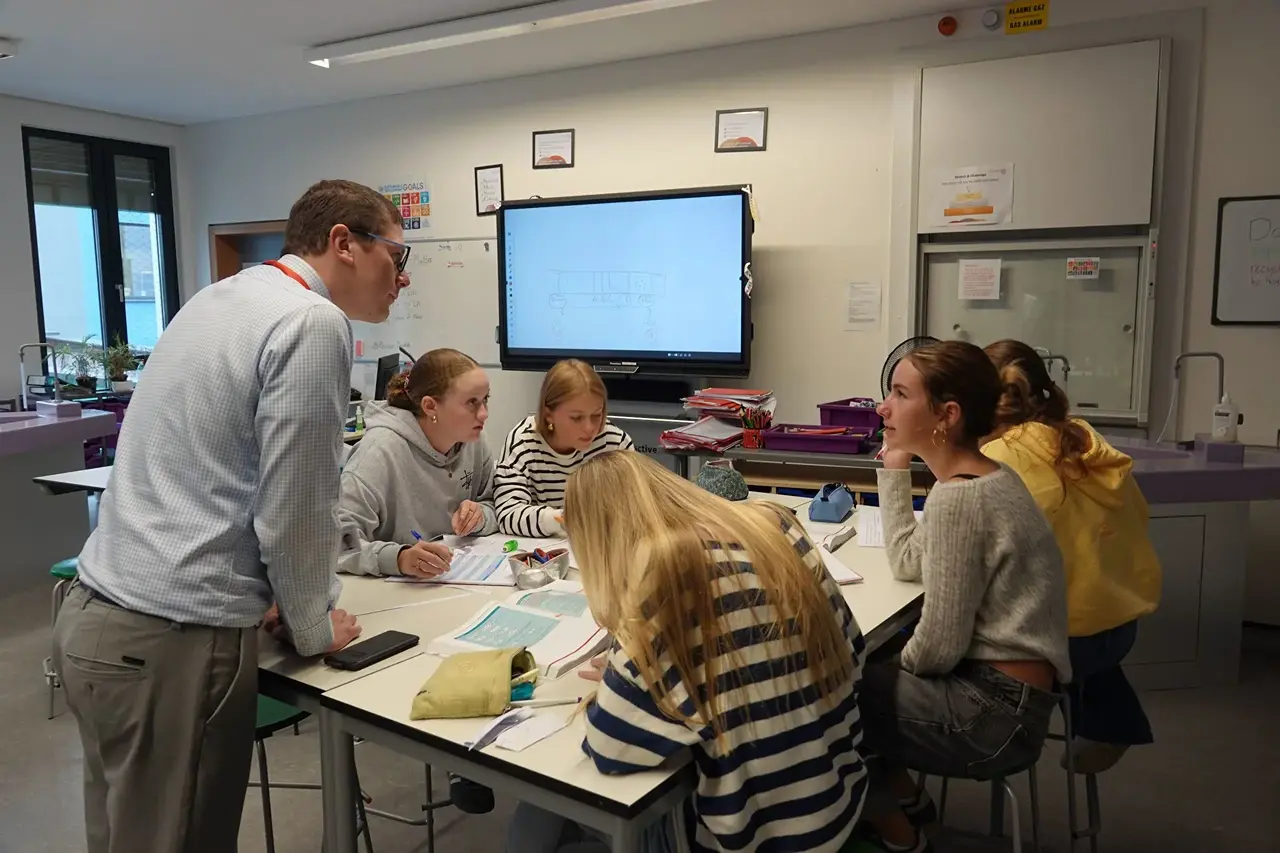 Teacher with students in classroom