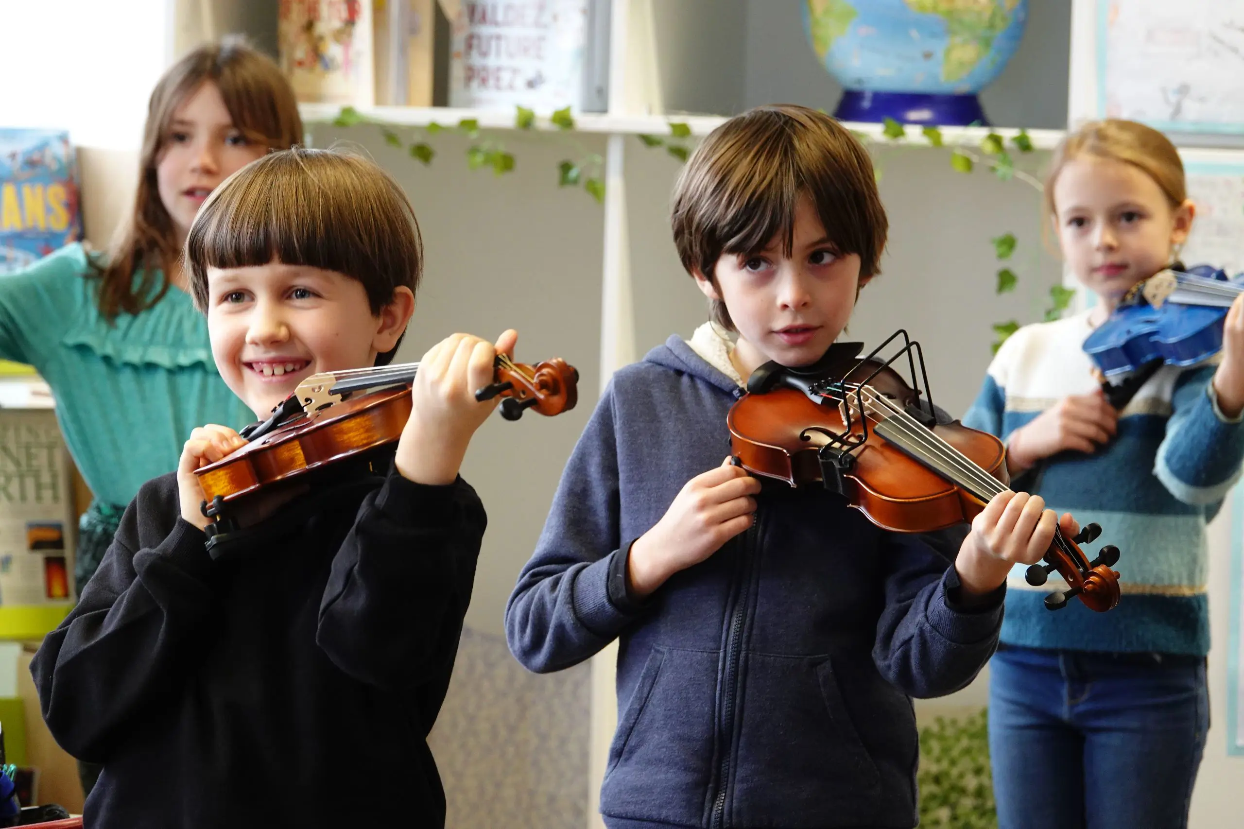 Children playing violins
